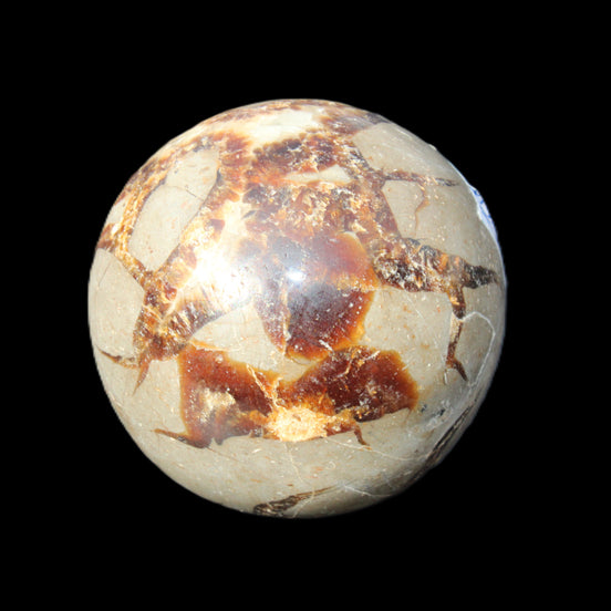 Septarian Dragon Stone sphere 51mm 192g in sunlight - Rocks and Things Store