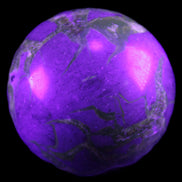 Septarian Dragon Stone sphere 51mm 192g in sunlight - Rocks and Things Store