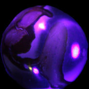 Marine Jasper sphere 45mm 126g Rocks and Things Store in UV light