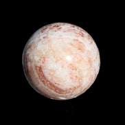 Rhodochrosite sphere 287g in sunlight - Rocks and Things Store