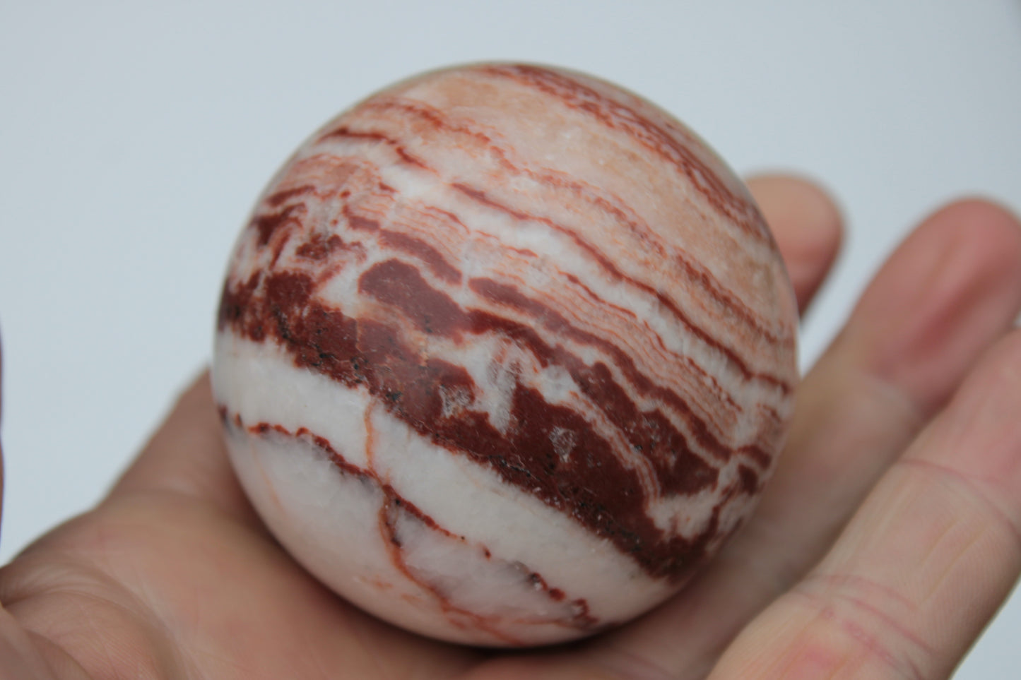 Rhodochrosite sphere 287g Rocks and Things