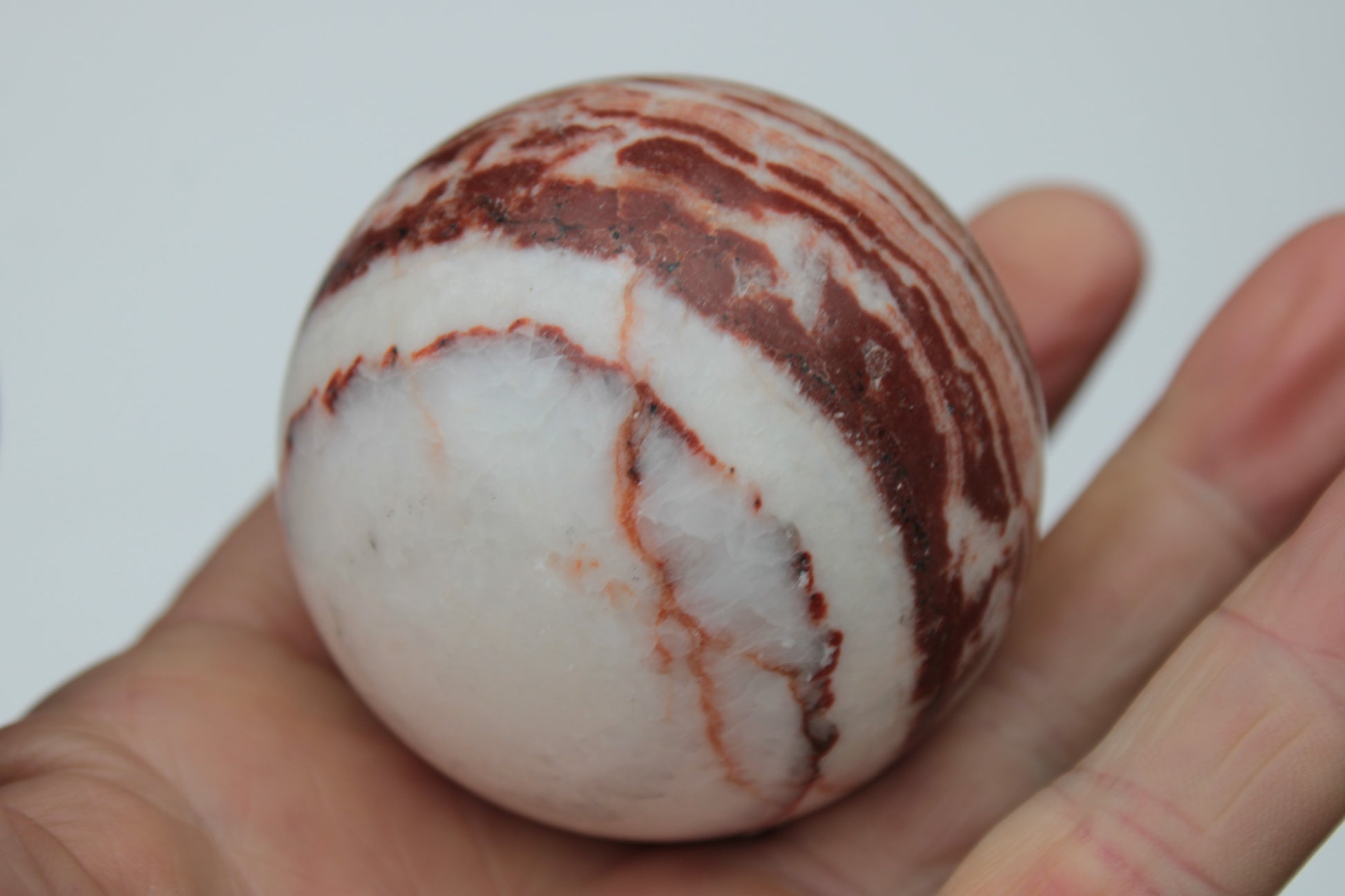 Rhodochrosite sphere 287g Rocks and Things