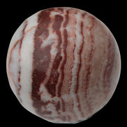 Rhodochrosite sphere 287g in sunlight - Rocks and Things Store