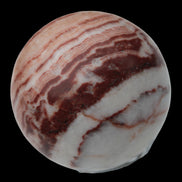 Rhodochrosite sphere 287g in sunlight - Rocks and Things Store