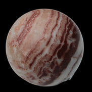 Rhodochrosite sphere 287g in sunlight - Rocks and Things Store