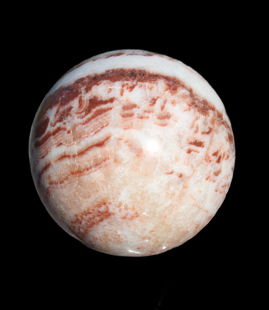 Rhodochrosite sphere 287g in sunlight - Rocks and Things Store