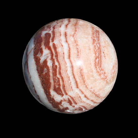 Rhodochrosite sphere 287g in sunlight - Rocks and Things Store