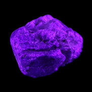 Blue Sapphire (unheated) 69g in UV light - Rocks and Things Store