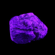 Blue Sapphire (unheated) 69g in UV light - Rocks and Things Store