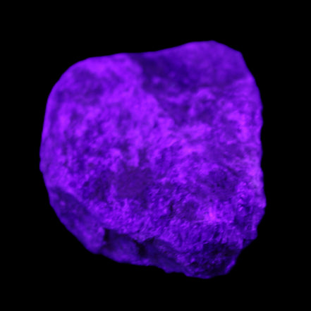 Blue Sapphire (unheated) 69g in UV light - Rocks and Things Store