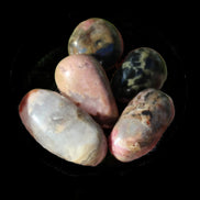 Rhodonite 4/5 tiny tumbled stone 12-19g in sunlight - Rocks and Things Store