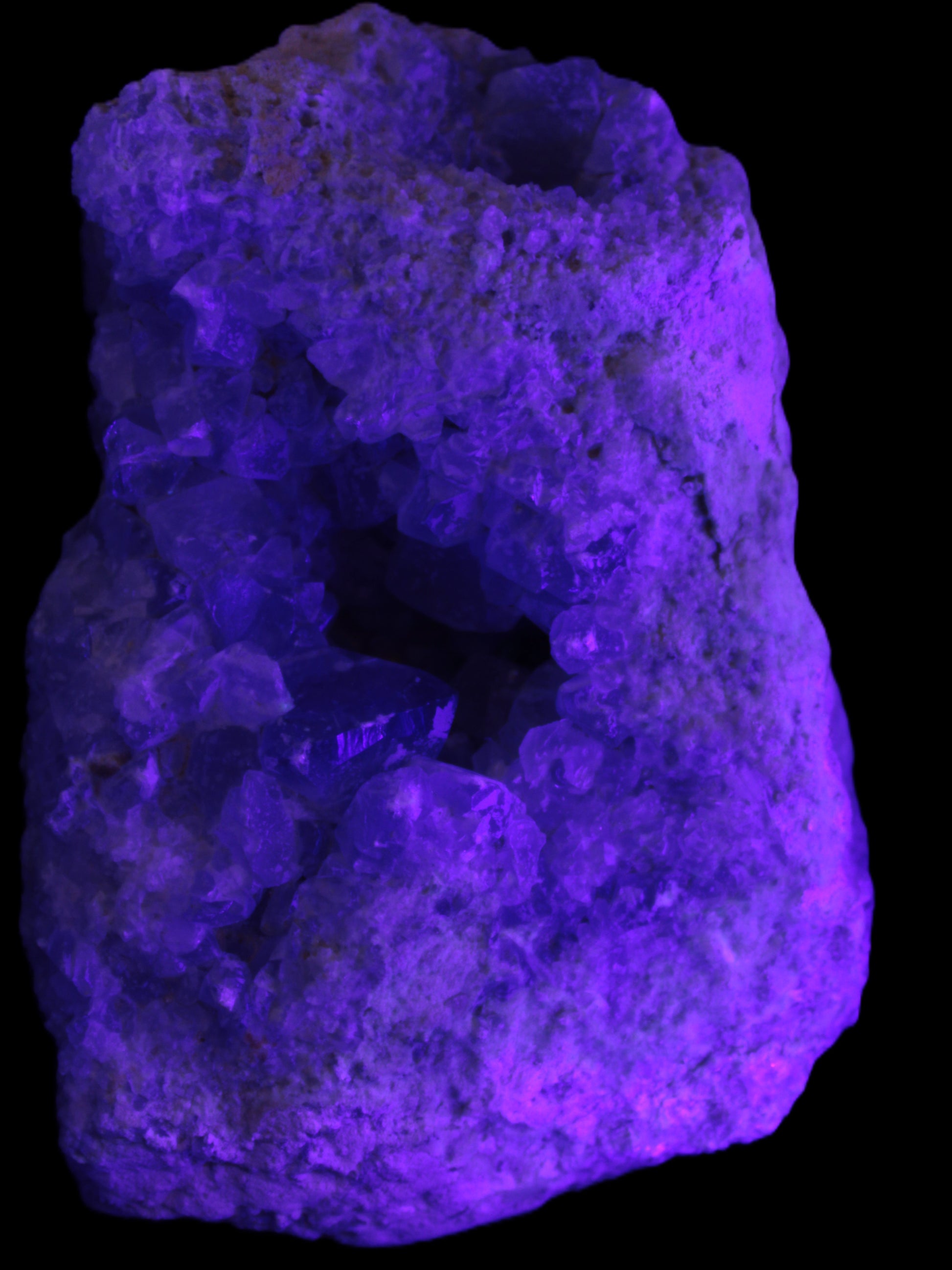 Celestite geode cluster 3840g in UV light