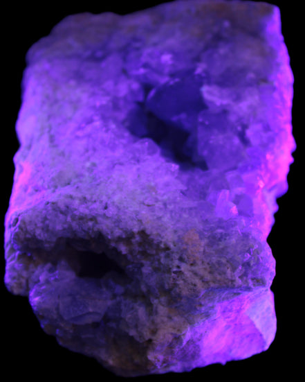 Celestite geode cluster 3840g in UV light
