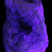 Celestite geode cluster 3840g in UV light
