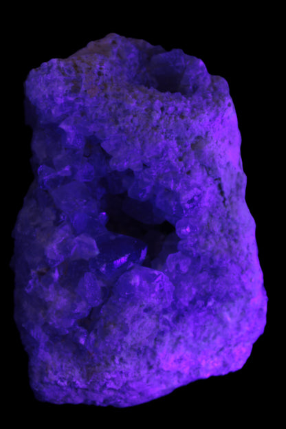 Celestite geode cluster 3840g in UV light