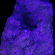 Celestite geode cluster 3840g in UV light - Rocks and Things Store