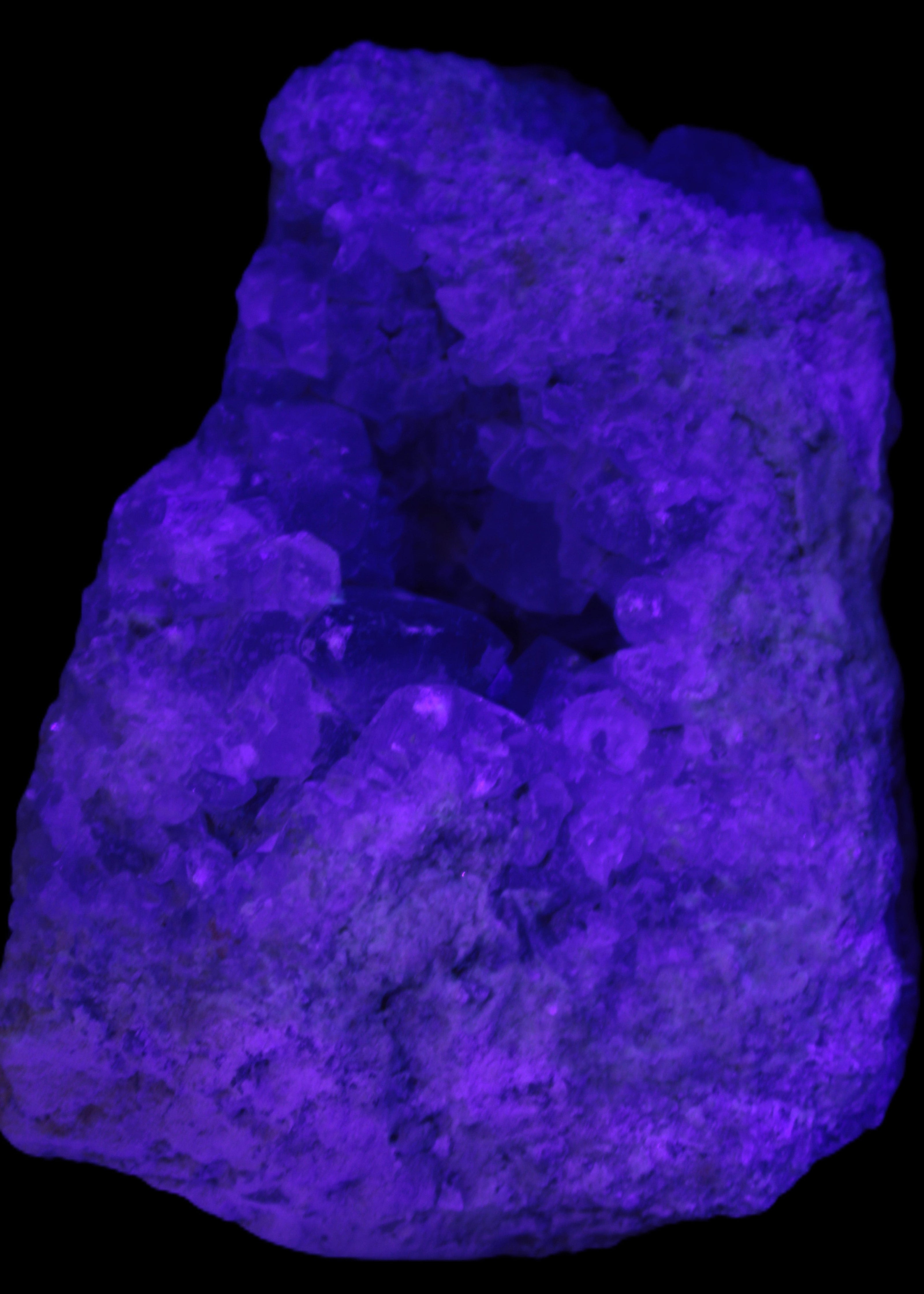 Celestite geode cluster 3840g in UV light - Rocks and Things Store