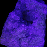 Celestite geode cluster 3840g in UV light