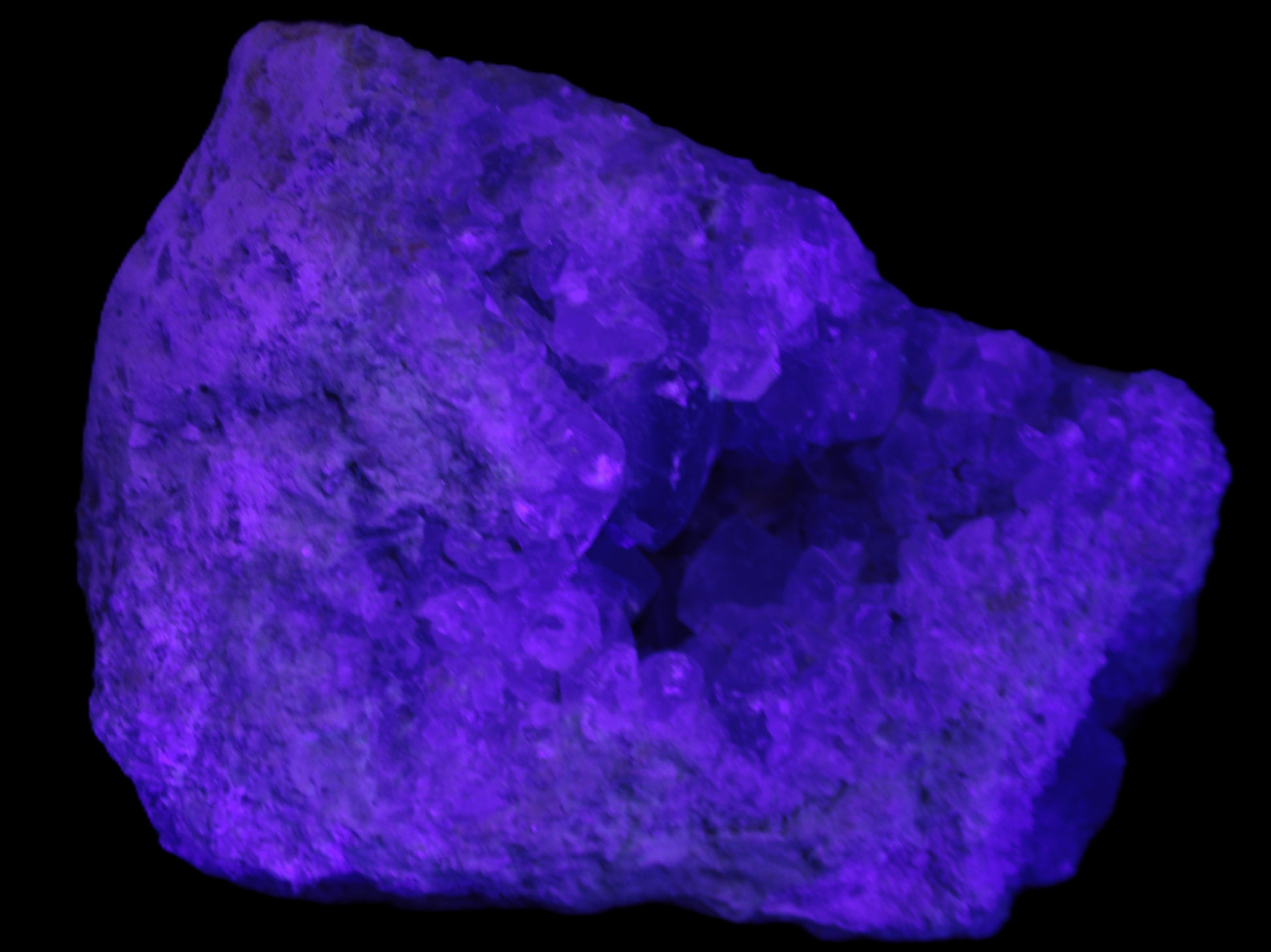 Celestite geode cluster 3840g in UV light