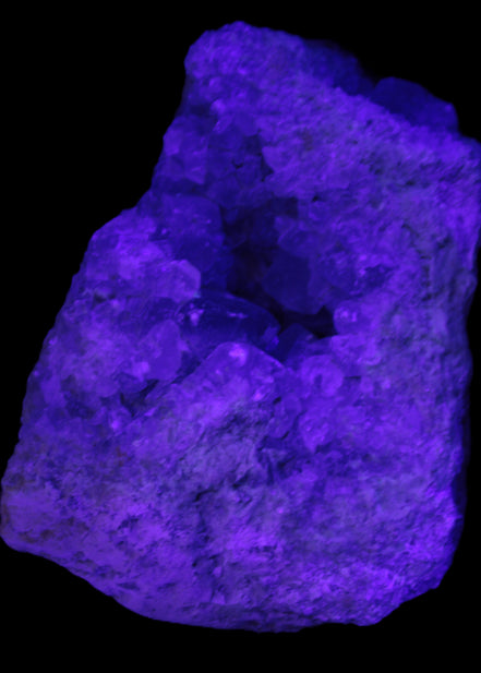 Celestite geode cluster 3840g in UV light