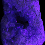 Celestite geode cluster 3840g in UV light