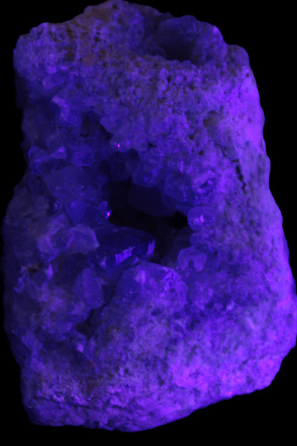 Celestite geode cluster 3840g in UV light