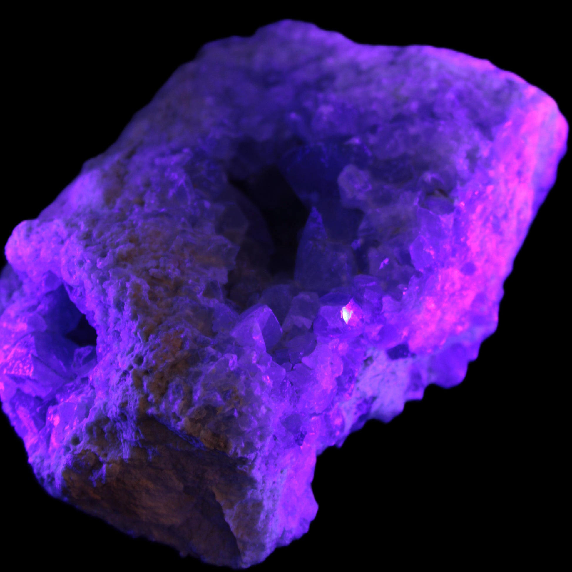 Celestite geode cluster 3840g in UV light