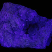 Celestite geode cluster 3840g in UV light