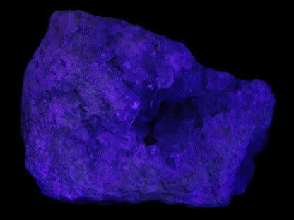 Celestite geode cluster 3840g in UV light