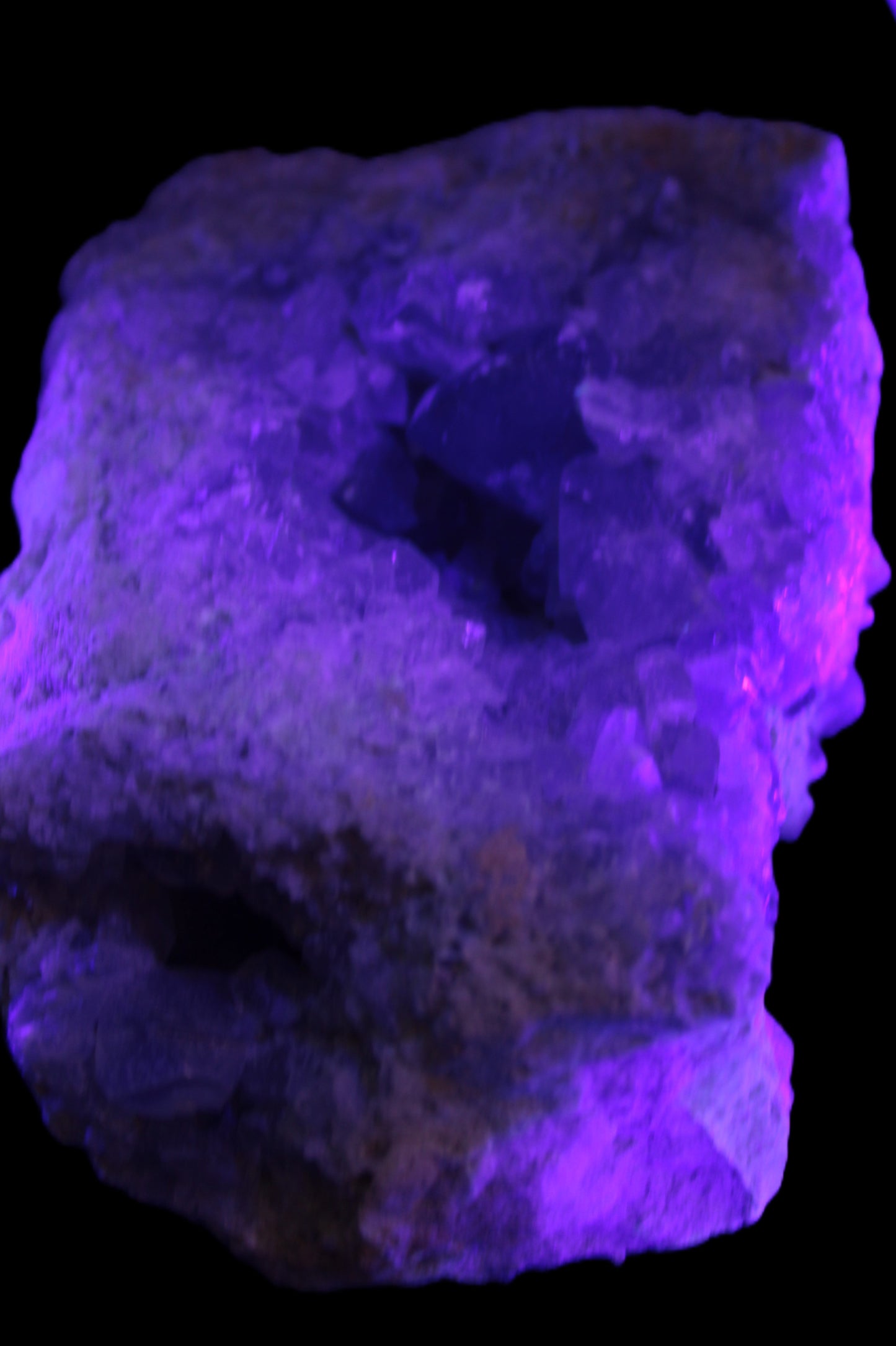 Celestite geode cluster 3840g in UV light