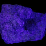 Celestite geode cluster 3840g in UV light