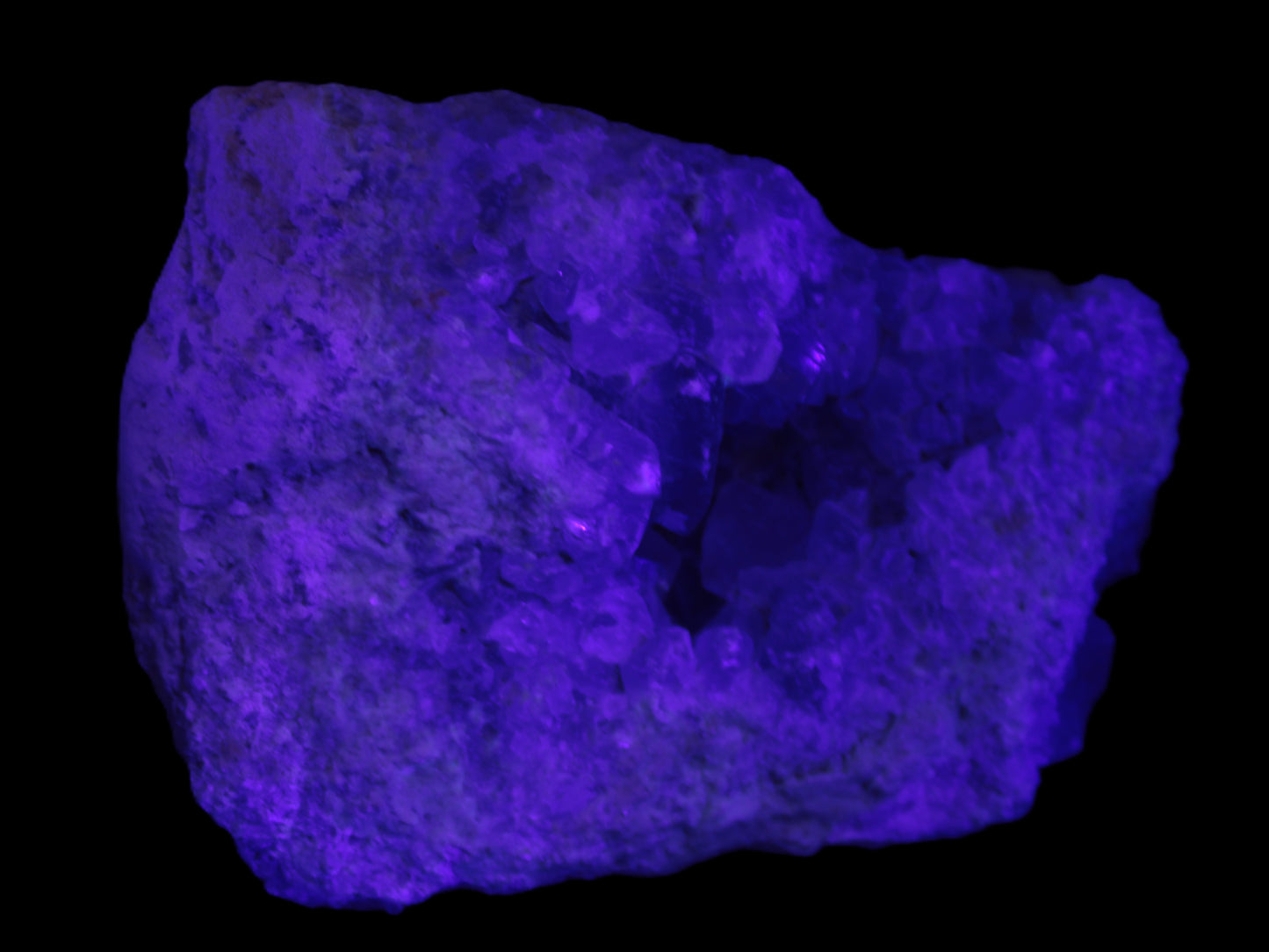 Celestite geode cluster 3840g in UV light