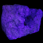 Celestite geode cluster 3840g in UV light
