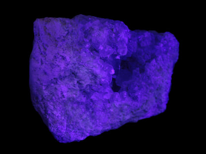 Celestite geode cluster 3840g in UV light