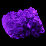Super Seven Amethyst cluster 99g in UV light - Rocks and Things Store
