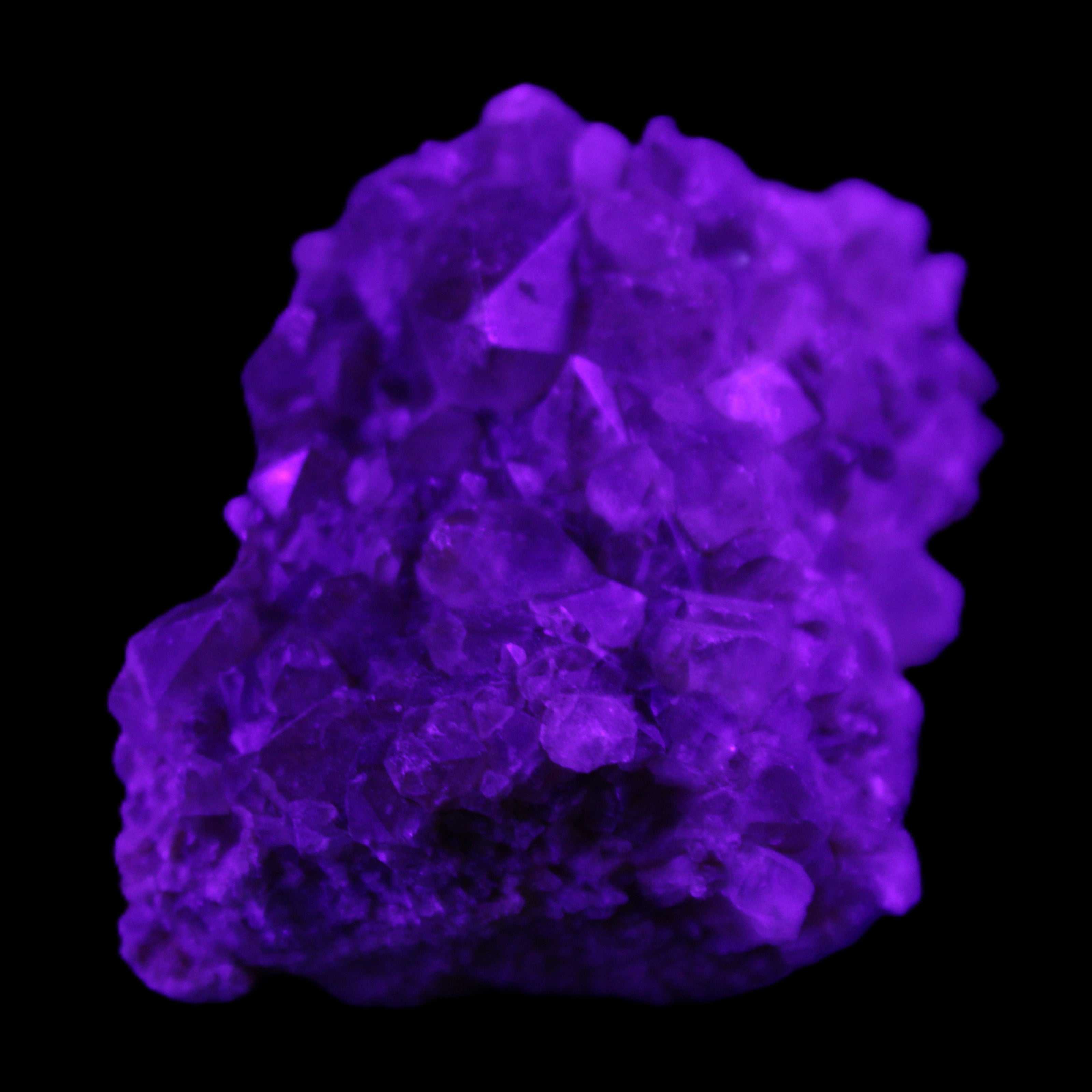 Super Seven Amethyst cluster 99g in UV light - Rocks and Things Store