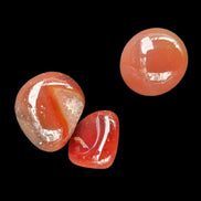 Red Agate 3/4 tumbled tiny stones 7-10g in sunlight - Rocks and Things Store