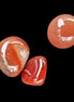 Red Agate 3/4 tumbled tiny stones 7-10g in sunlight - Rocks and Things Store
