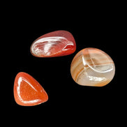 Red Agate 3/4 tumbled tiny stones 7-10g in sunlight - Rocks and Things Store