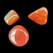 Red Agate 3/4 tumbled tiny stones 7-10g in sunlight - Rocks and Things Store