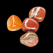 Red Agate 3/4 tumbled tiny stones 7-10g in sunlight - Rocks and Things Store