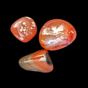 Red Agate 3/4 tumbled tiny stones 7-10g in sunlight - Rocks and Things Store