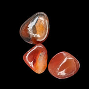Red Agate 3/4 tumbled tiny stones 7-10g in sunlight - Rocks and Things Store
