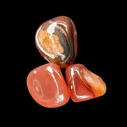 Red Agate 3/4 tumbled tiny stones 7-10g in sunlight - Rocks and Things Store
