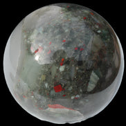 African Bloodstone sphere 84mm 831g in sunlight - Rocks and Things Store