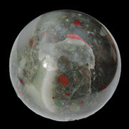 African Bloodstone sphere 84mm 831g in sunlight - Rocks and Things Store