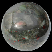 African Bloodstone sphere 84mm 831g in sunlight - Rocks and Things Store