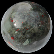 African Bloodstone sphere 84mm 831g in sunlight - Rocks and Things Store