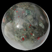 African Bloodstone sphere 84mm 831g in sunlight - Rocks and Things Store