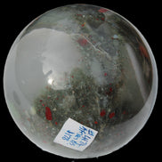 African Bloodstone sphere 84mm 831g in sunlight - Rocks and Things Store